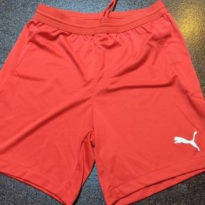 Red PUMA soccer shorts, youth size Medium, like new!